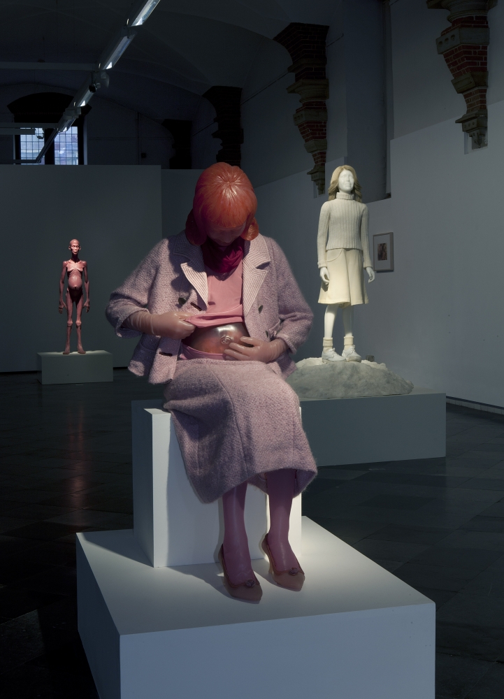 Installation view from Edmier's exhibition at Frans Hal Museum in 2013. Fesatures Pink beverly edmier sculpture in foreground, white sculpture of woman in the middle ground and pink alien sculpture in the background. 